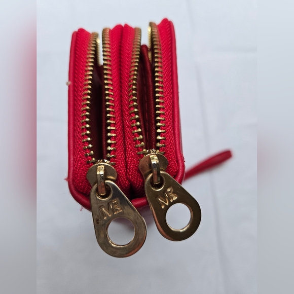 Red wallet with 2 zipper compartments and a wrist handle. - Picture 5 of 12